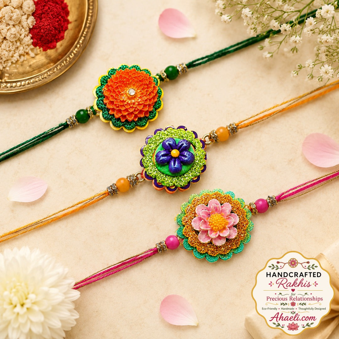 Eco-friendly handmade paper and clay floral rakhi set of 3 featuring colorful handpainted flower designs for Raksha Bandhan.