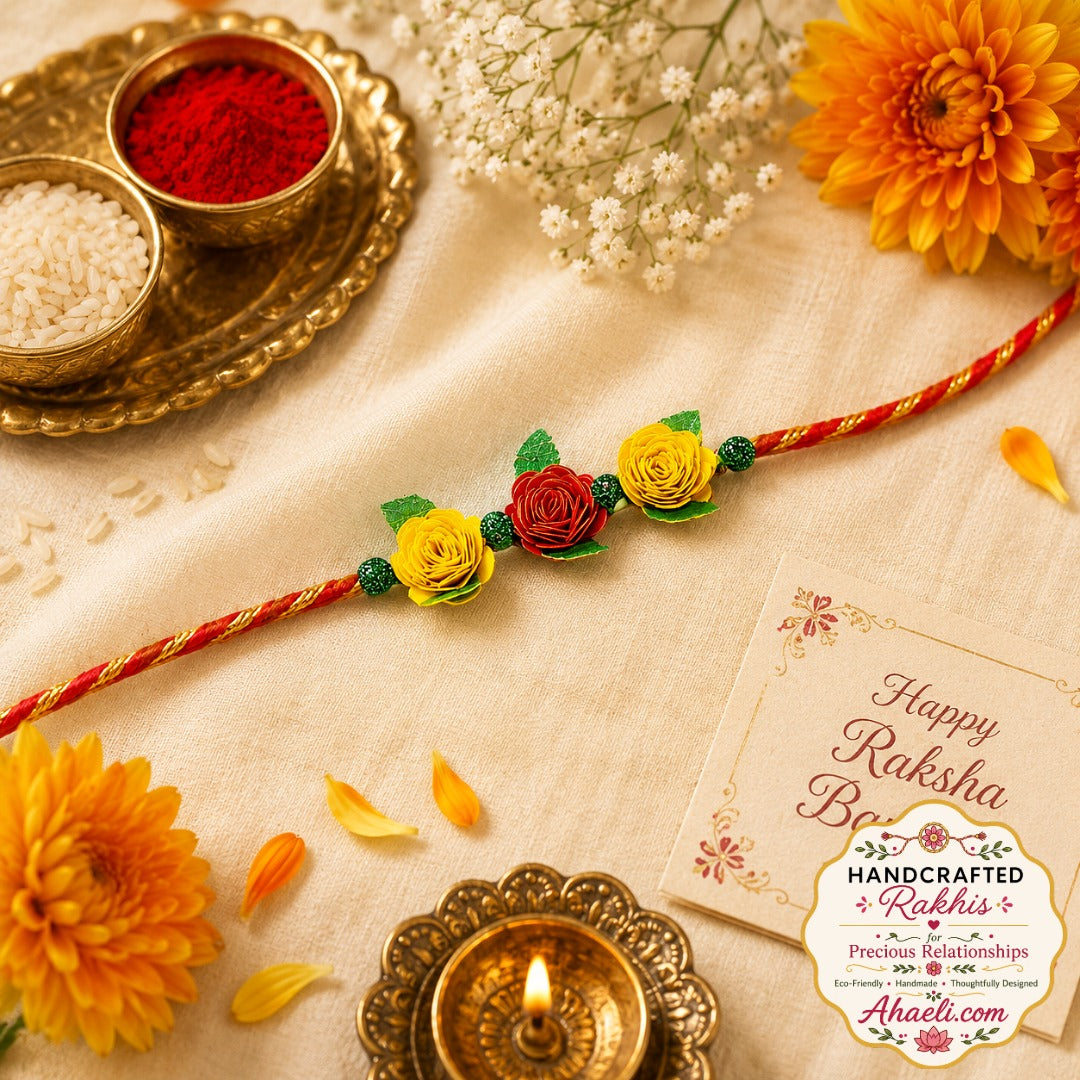 Handmade paper quilled rose garden rakhi featuring red and yellow quilled roses for Raksha Bandhan.