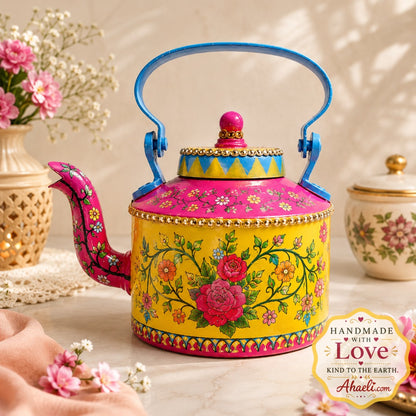 Ahaeli Hand-painted yellow floral teapot with pink lid, blue handle, and colorful folk art flowers displayed in a premium home décor setting.