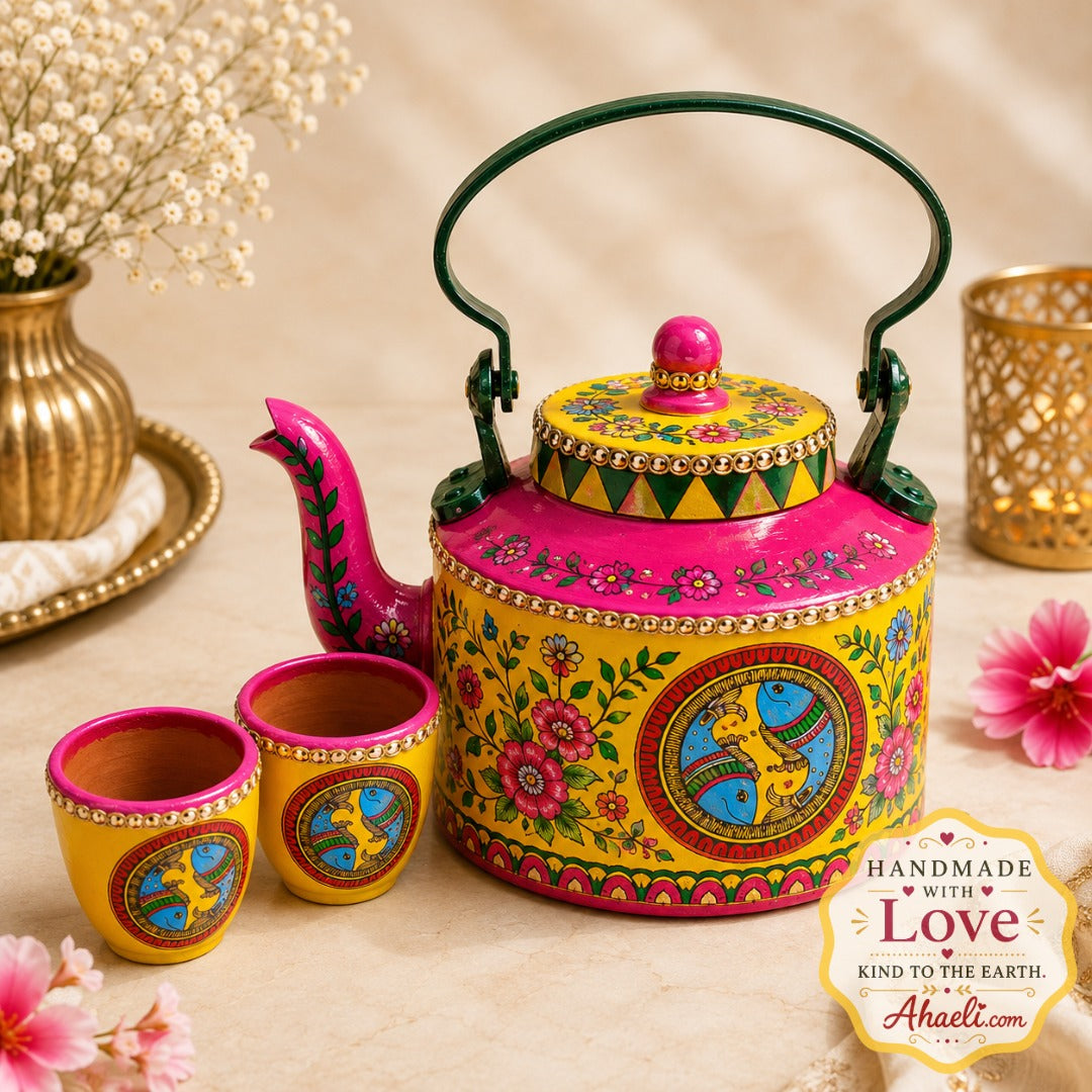 Ahaeli Hand-painted madhubani teapot with intricate floral folk art detailing in vibrant yellow and pink with premium artisan finish.