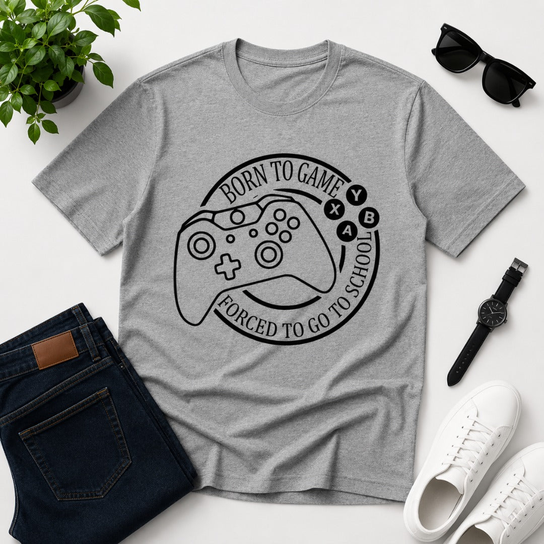 Men's grey cotton T-shirt featuring a gaming controller graphic with the funny quote "Born to Game, Forced to Go to School".