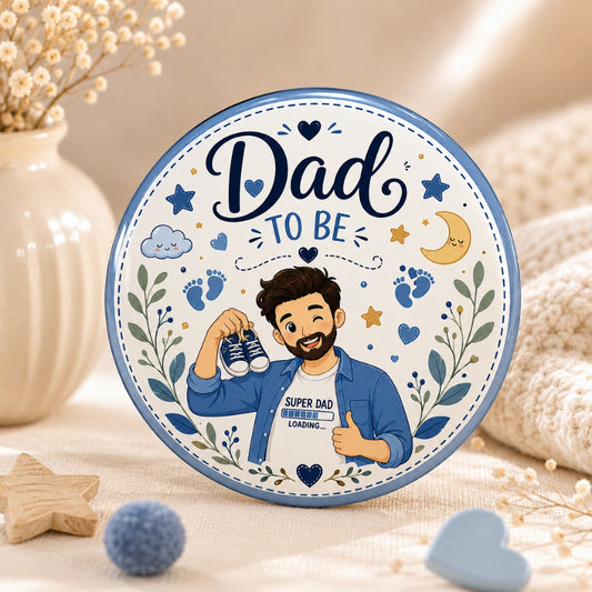 Dad-to-Be Baby Shower Badge featuring a cute father-to-be holding baby shoes with Super Dad Loading illustration on a premium 58mm glossy round metal keepsake pin.