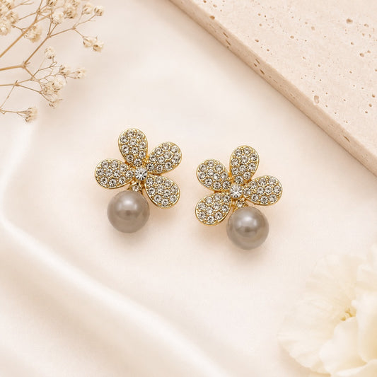 Elegant Crystal Flower Pearl Droplet Stud Earrings for Women featuring gold-tone floral crystal studs with an artificial pearl droplet.