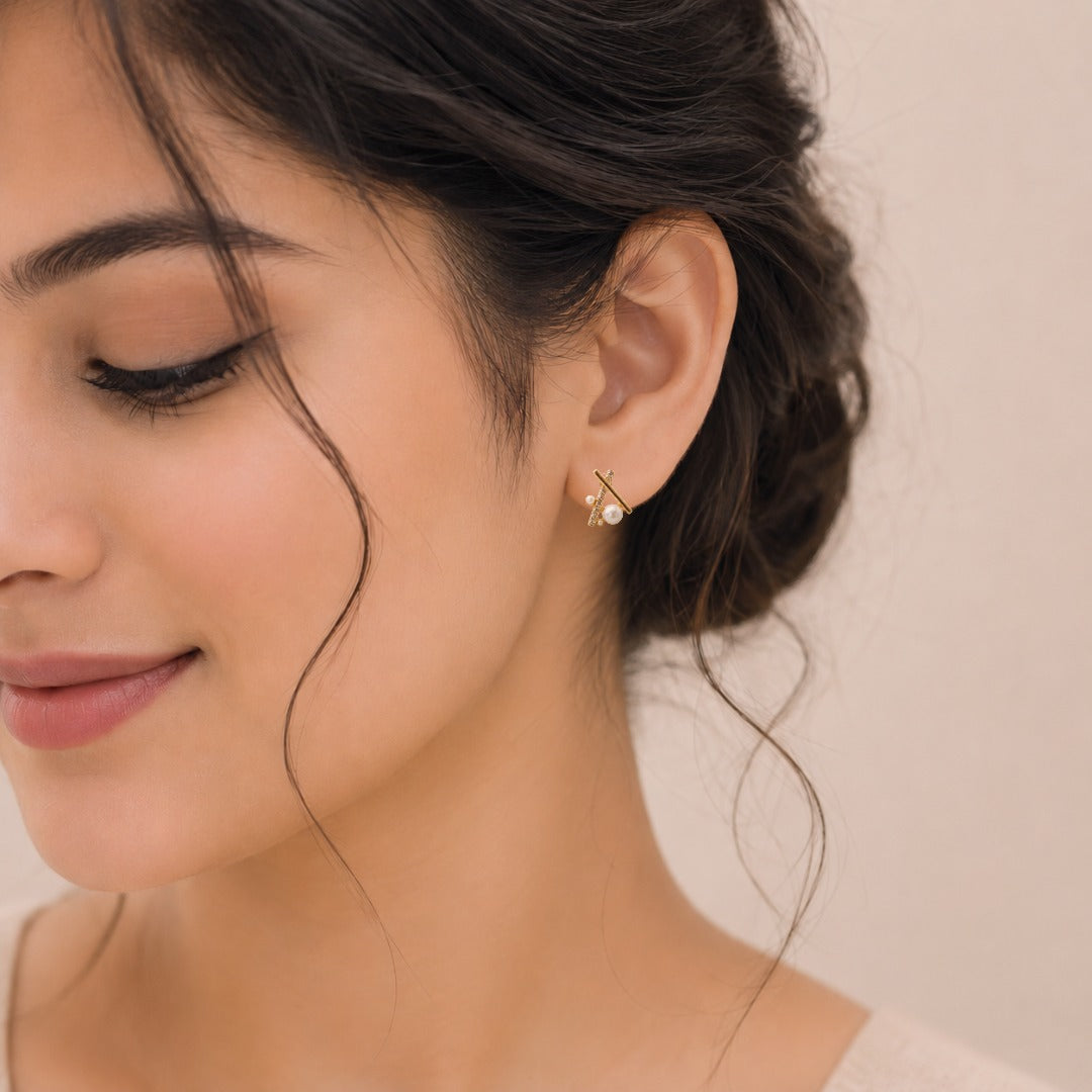 Woman wearing Elegant Pearl Crystal Geometric Stud Earrings for Women, lightweight gold geometric pearl stud earrings for everyday and office wear.
