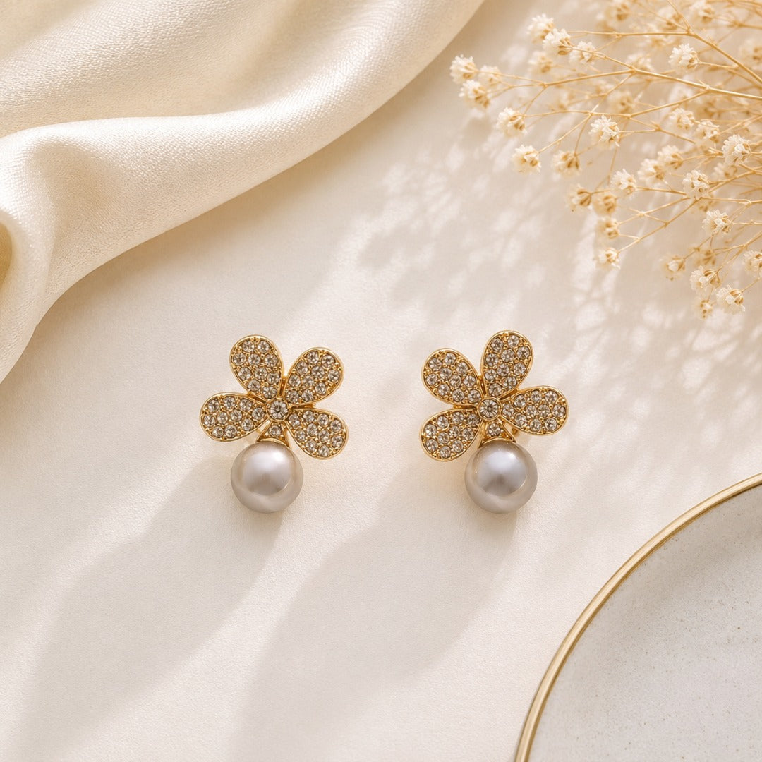 Gold crystal flower artificial pearl droplet stud earrings with sparkling floral design and elegant pearl drop for women.