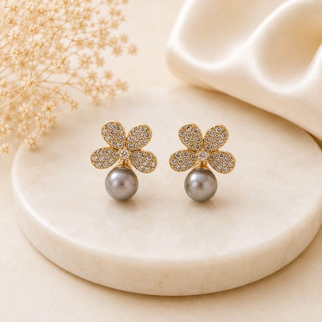 Close-up of Elegant Crystal Flower Pearl Droplet Stud Earrings featuring shimmering crystals, gold-tone finish and artificial pearl droplet.