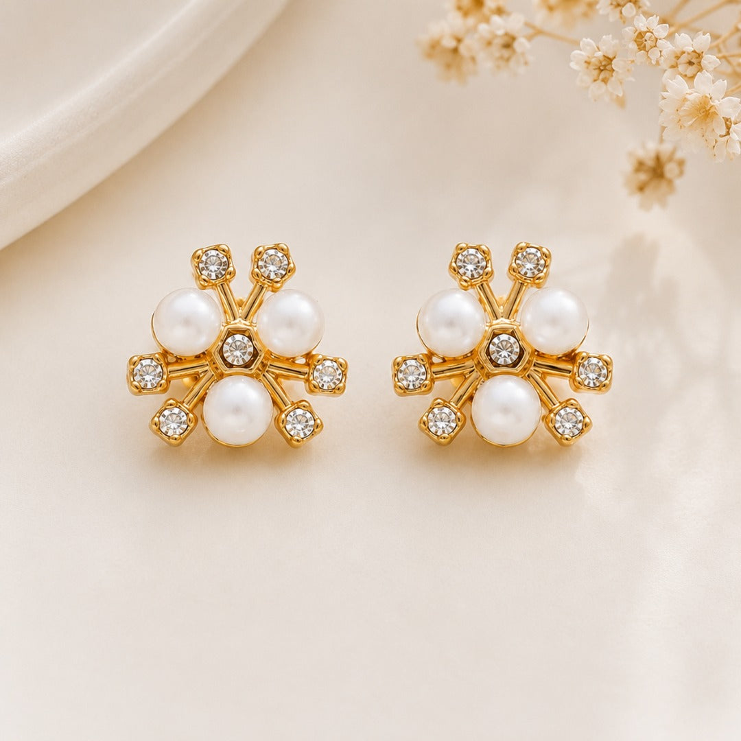 Elegant floral pearl stud earrings for women with gold-tone finish and sparkling CZ stones.
