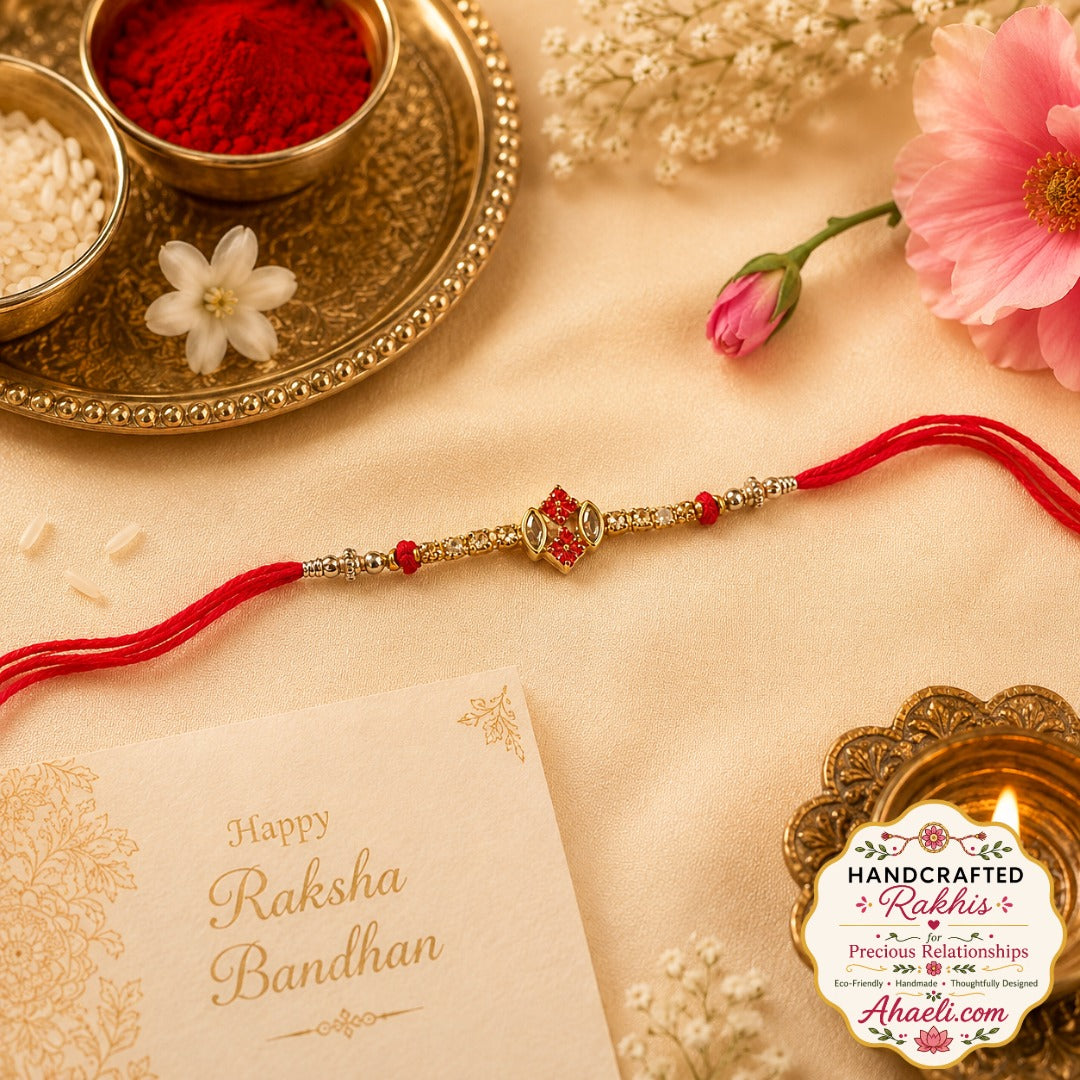A handcrafted crimson Kundan rakhi featuring elegant red stones, metallic detailing, and a minimal designer aesthetic for a sophisticated Raksha Bandhan celebration.