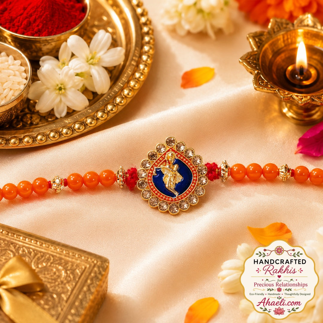 Handcrafted Murli Krishna rakhi with orange beads and decorative stones for Raksha Bandhan