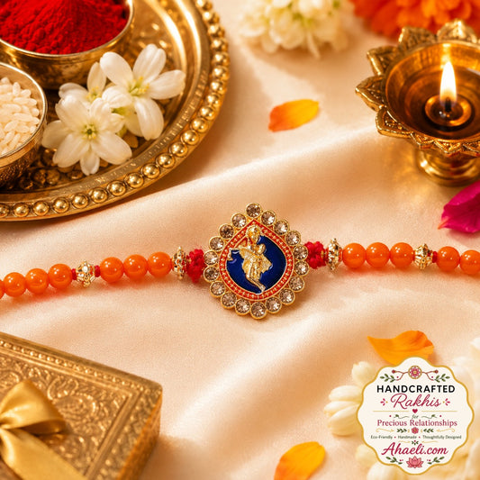 Handcrafted Murli Krishna rakhi with orange beads and decorative stones for Raksha Bandhan