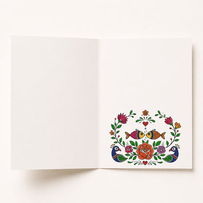 Open Madhubani birthday card with traditional peacock, floral and folk art design inside