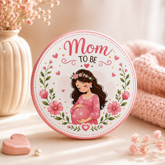 Mom-to-Be Baby Shower Badge with floral pregnant mother illustration, 58mm glossy round metal keepsake pin for baby shower, pregnancy announcement and gender reveal celebration.