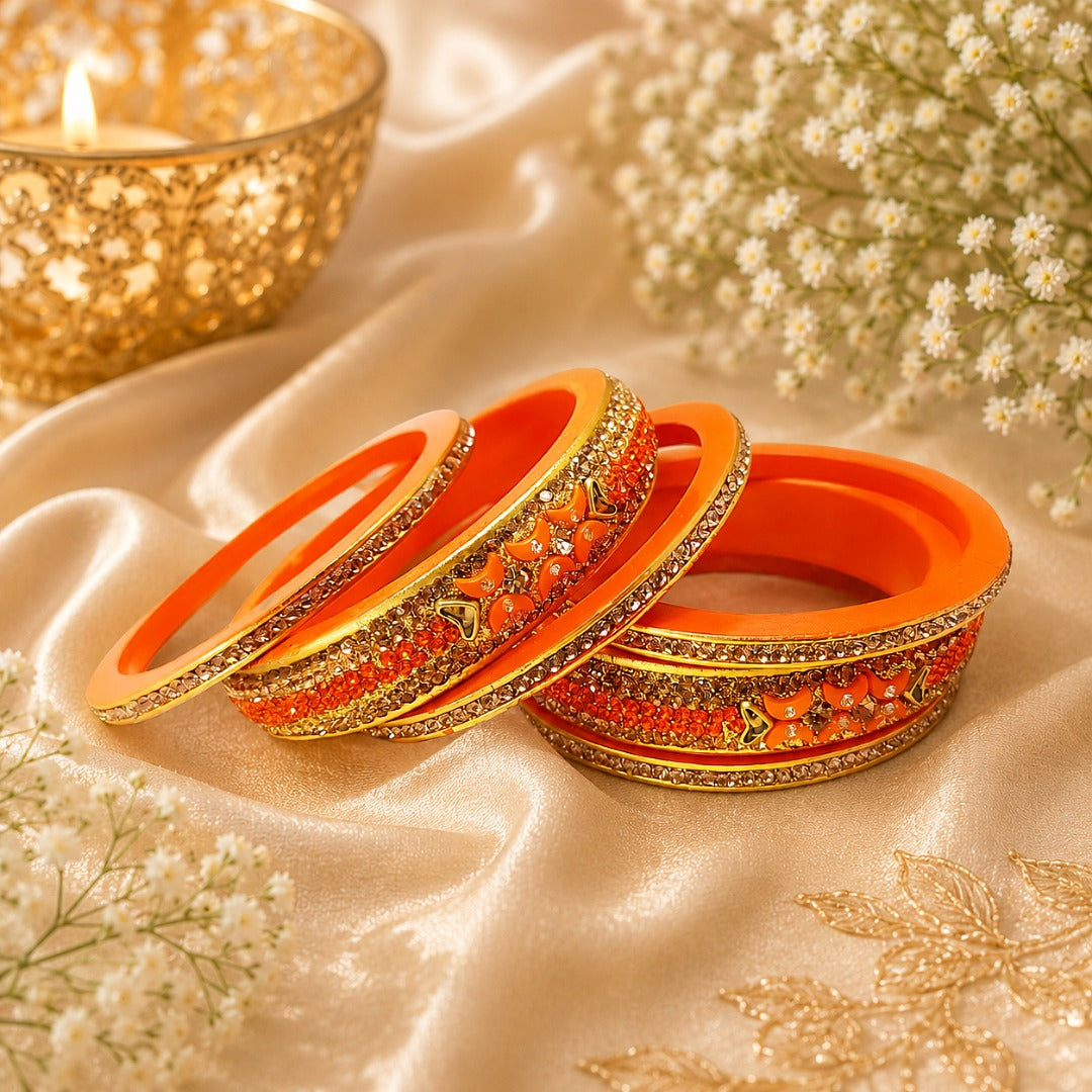 Orange traditional bangle set for women with stone work detailing, ideal for weddings, festive occasions, bridal wear, and ethnic celebrations.