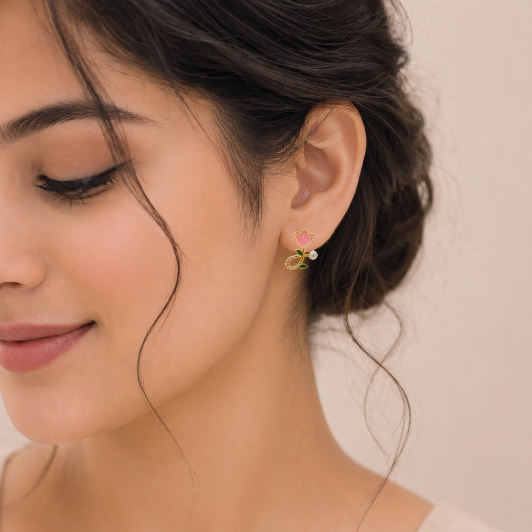 Woman wearing Elegant Pink Floral Pearl Stud Earrings with Gold Finish