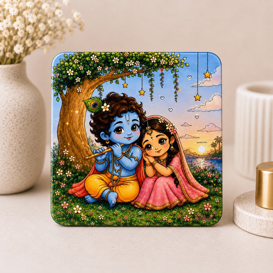 Cute Radha Krishna acrylic fridge magnet featuring Lord Krishna playing the flute with Radha under a flowering tree, premium square refrigerator magnet for home decor and spiritual gifting.