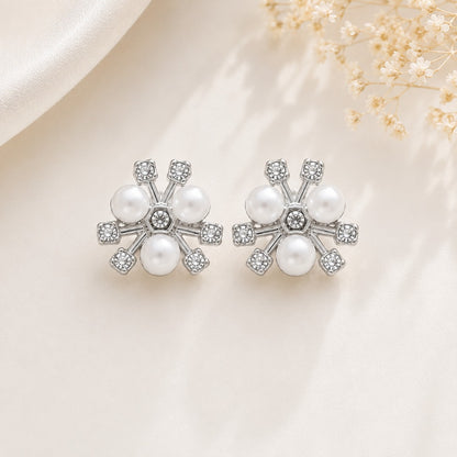 Close-up of silver pearl flower stud earrings with crystal accents for women featuring a classic floral design.