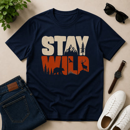 Men's navy blue cotton T-shirt featuring a Stay Wild graphic with mountains, bear, deer, pine trees, and bird silhouettes in a vintage wildlife design.