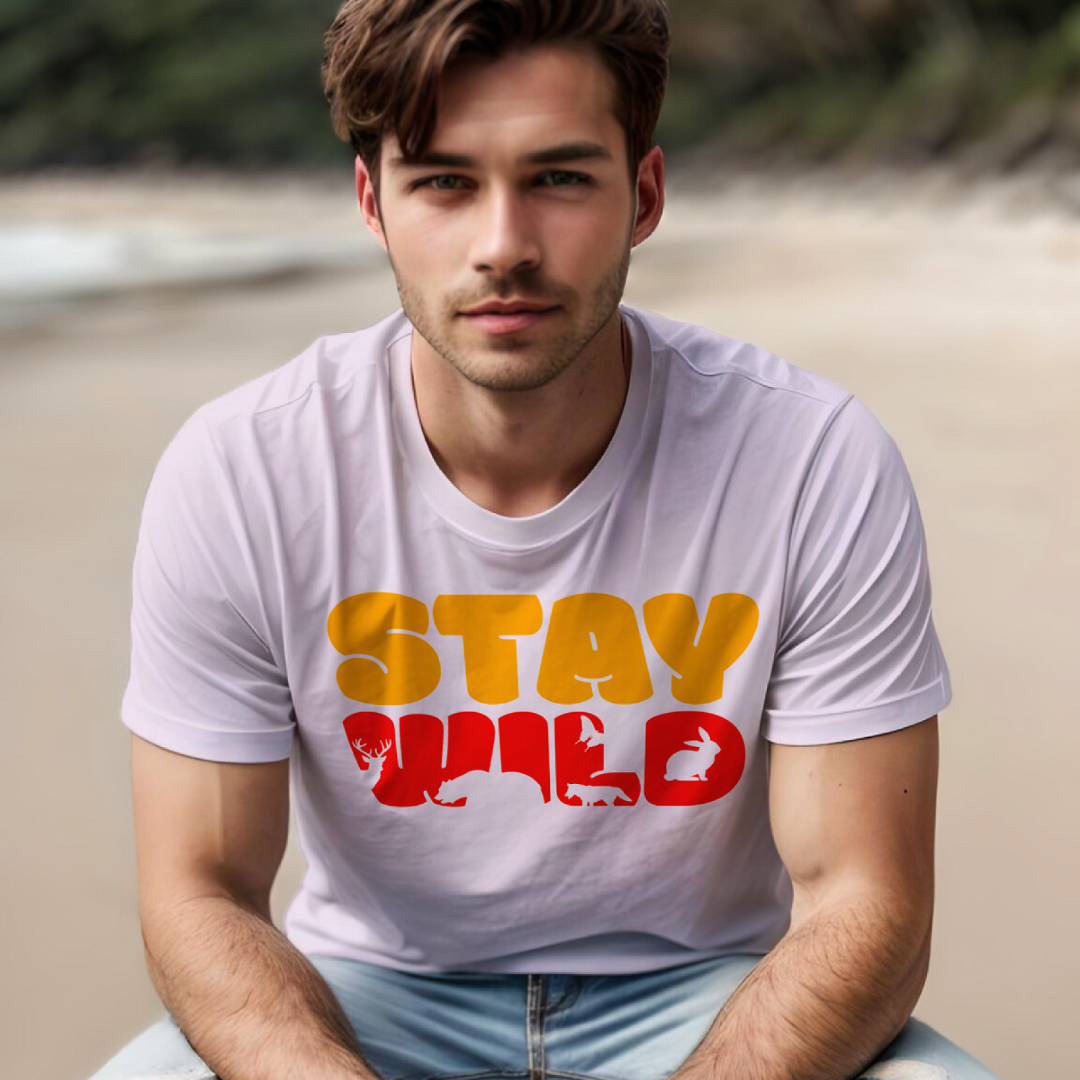 Stay Wild men's cotton t-shirt in light pink featuring a wildlife graphic and nature inspired artwork