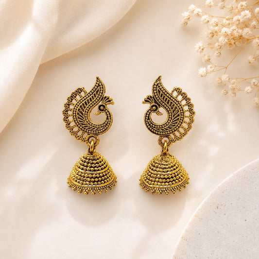 Traditional peacock jhumka earrings for women in antique gold finish front view