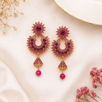 Traditional pink crystal chandbali drop earrings for women with gold-tone finish and bead drop for festive and wedding wear.