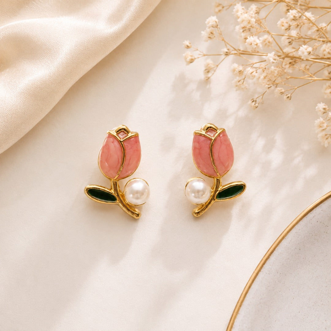 Pink tulip flower stud earrings with artificial pearl accents and gold-tone finish for women.