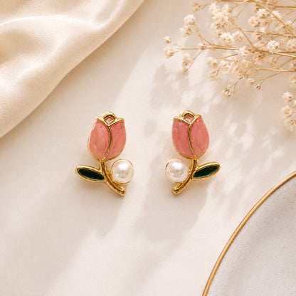 Pink tulip flower stud earrings with artificial pearl accents and gold-tone finish for women.